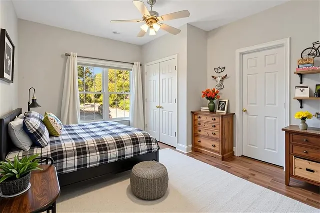 a view of a yard with plants and a fountain