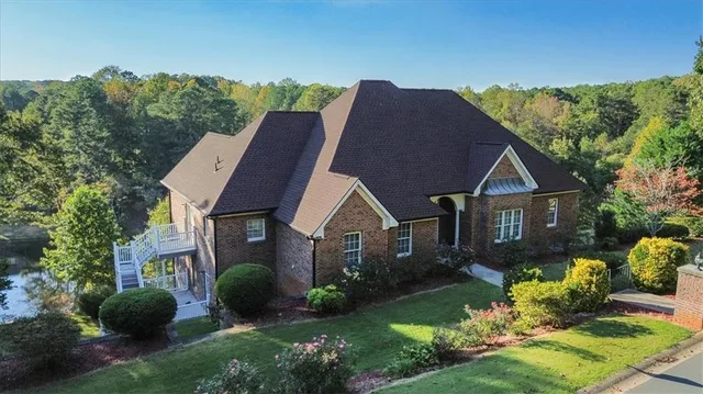a living room with fireplace furniture and a wooden floor