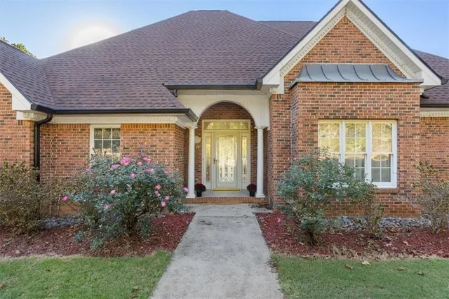 a living room with furniture large window and fireplace