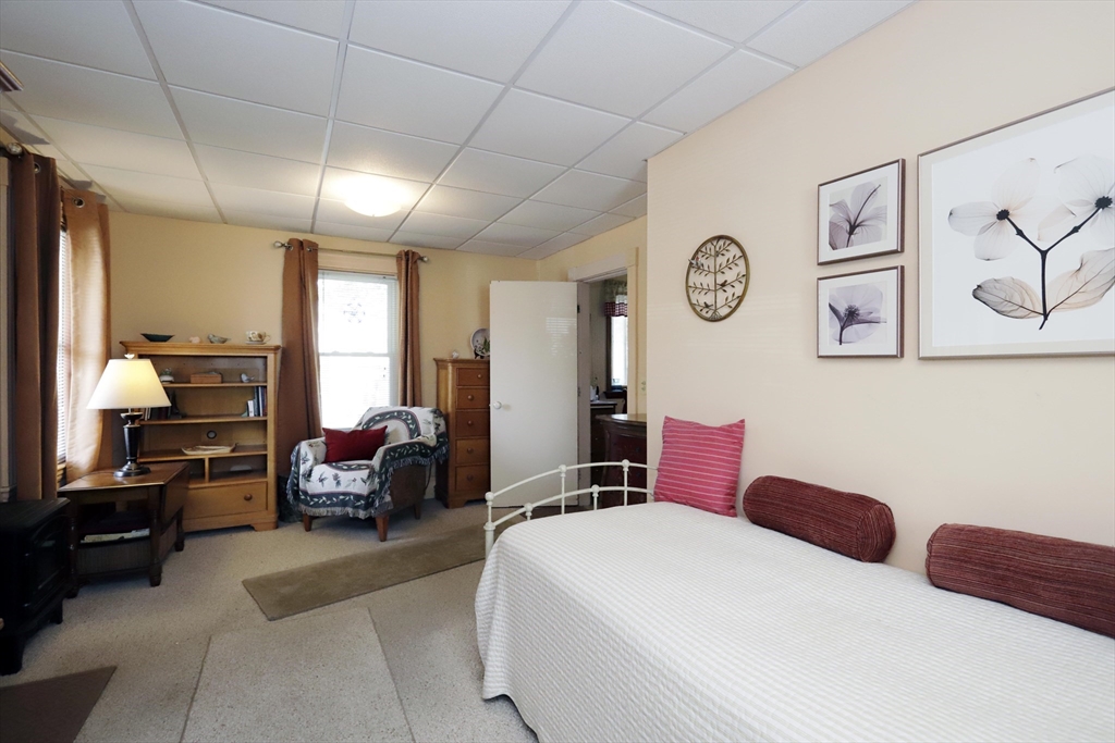 5 Anthony Street Acushnet, MA 02743 - Photo 13 of 37 a bedroom with furniture and a large window