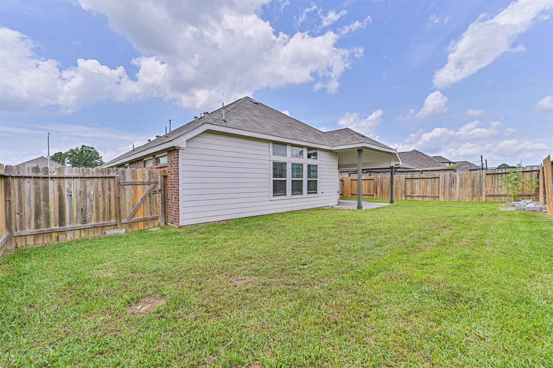 7019 Terra Drive Manvel, TX 77578 - Photo 40 of 41 a view of a house with a yard and sitting area