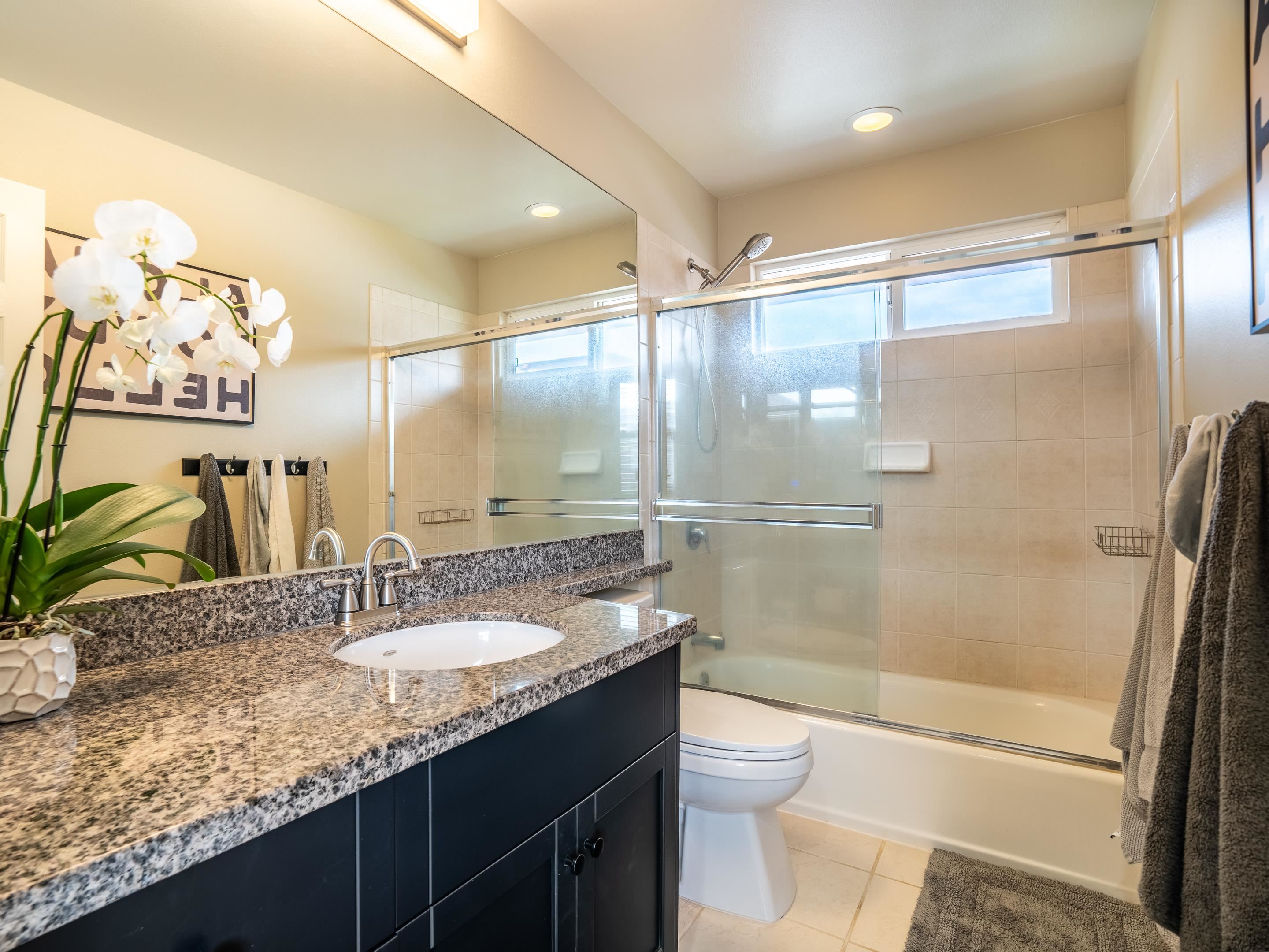 42 Maunaleo Place Wailuku, HI 96793 - Photo 26 of 36 a bathroom with a granite countertop sink toilet and shower