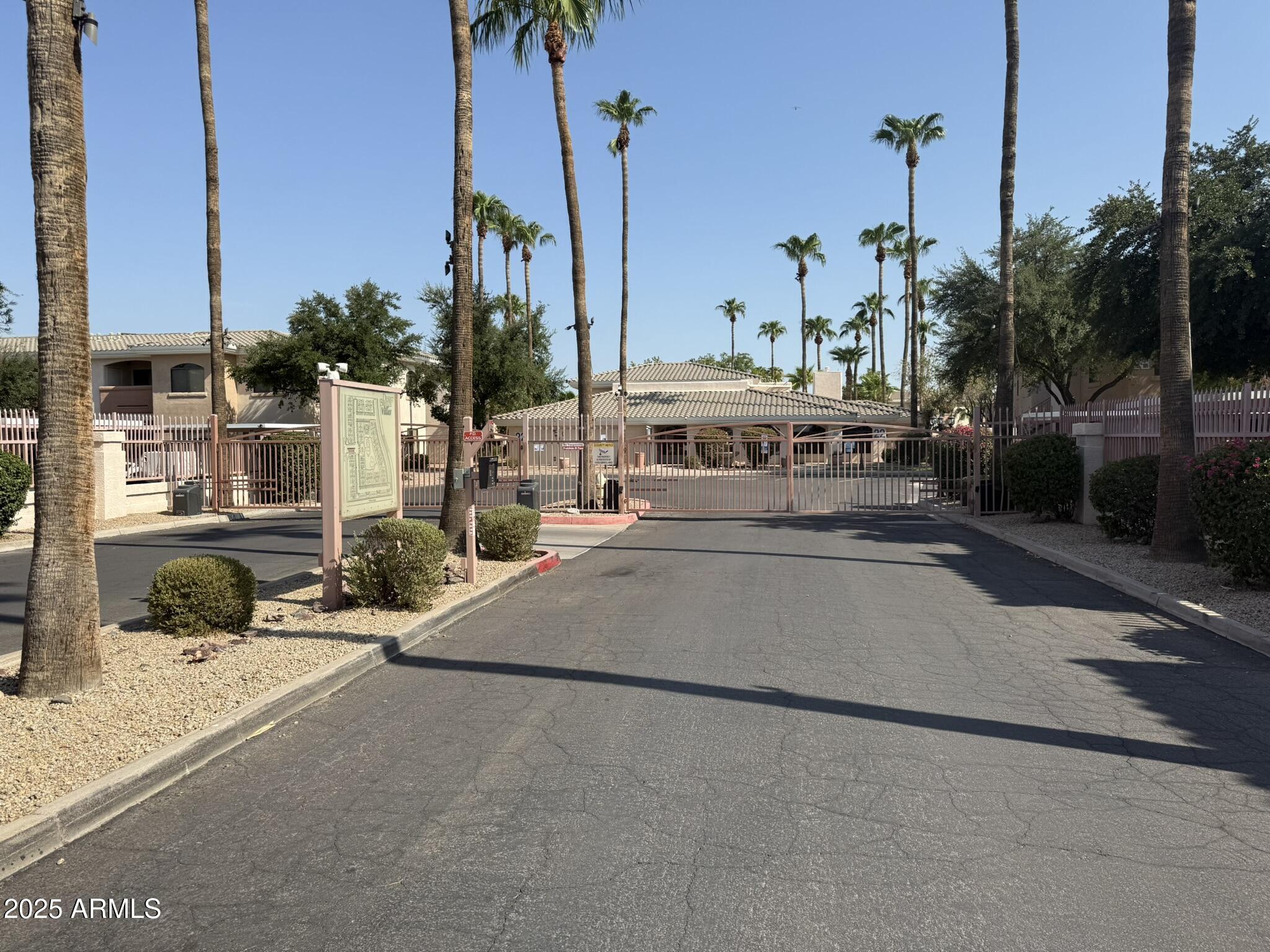 10030 West Indian School Road, Unit 164 Phoenix, AZ 85037 - Photo 2 of 16 a view of a street with cars