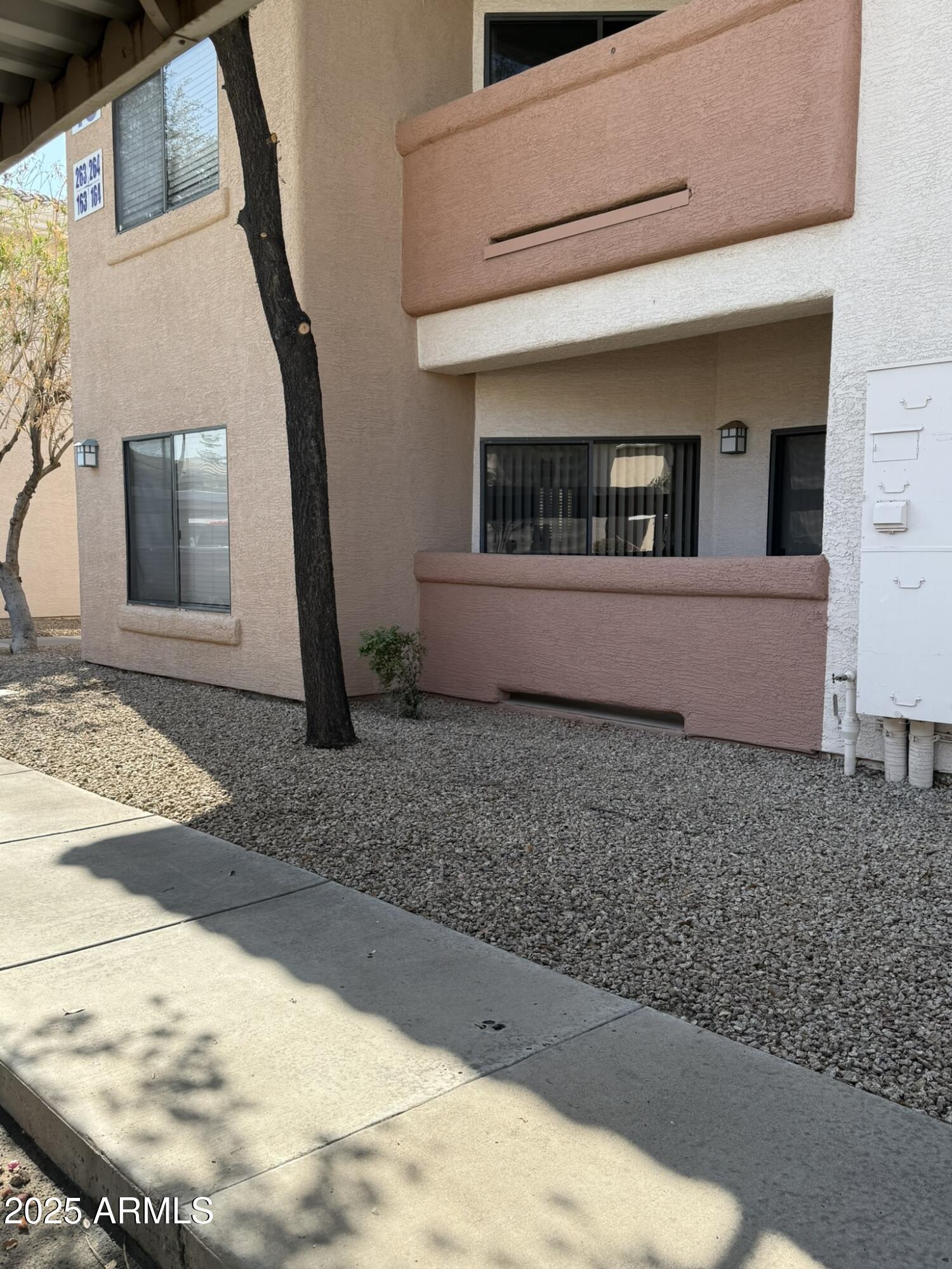 10030 West Indian School Road, Unit 164 Phoenix, AZ 85037 - Photo 5 of 16 a view of a house with a patio