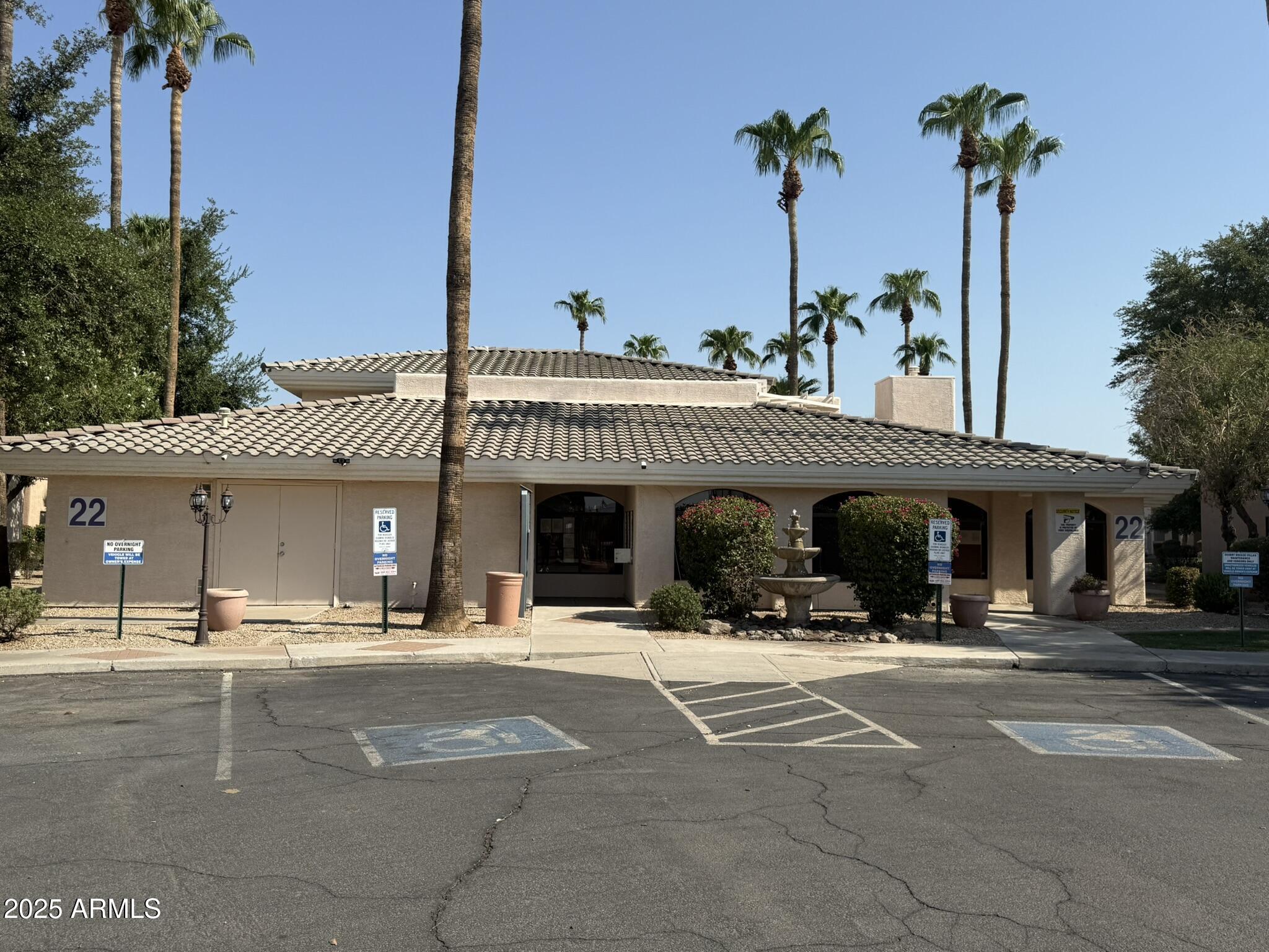 10030 West Indian School Road, Unit 164 Phoenix, AZ 85037 - Photo 6 of 16 a view of a building with a palm tree