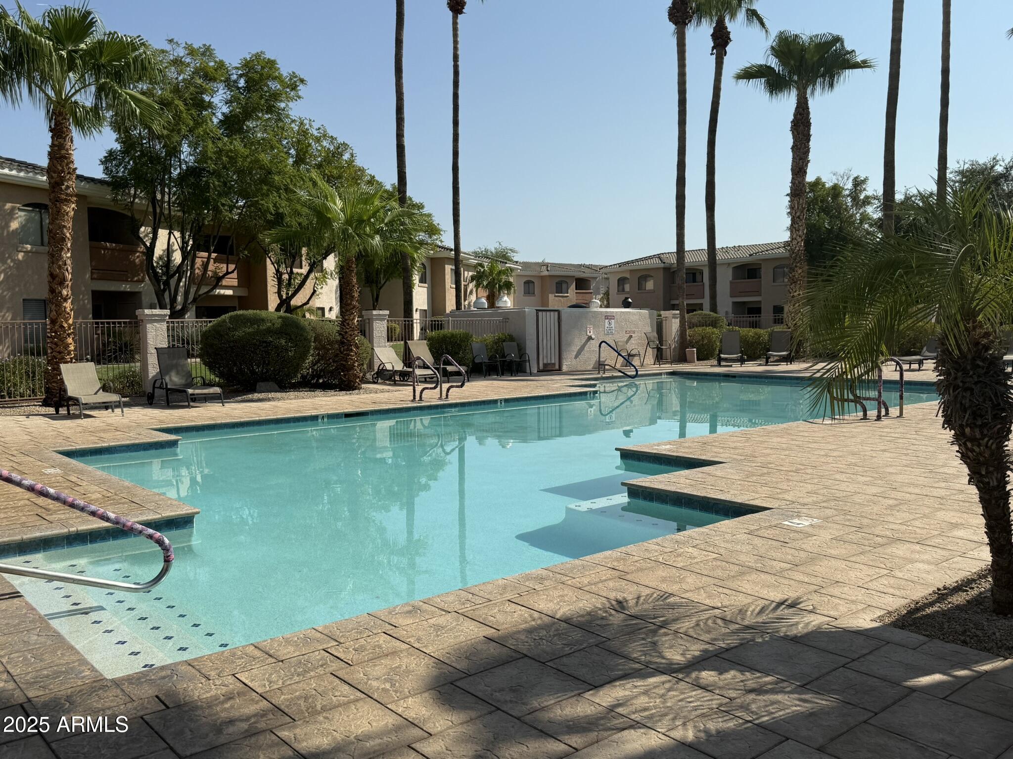 10030 West Indian School Road, Unit 164 Phoenix, AZ 85037 - Photo 8 of 16 a view of a garden with a slide