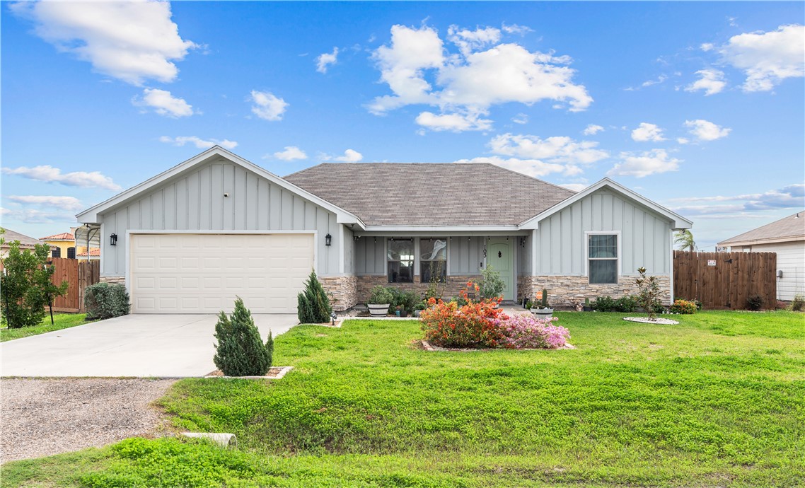 a front view of house with yard and outdoor seating