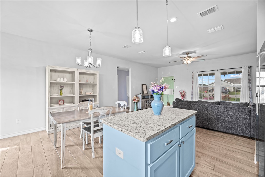 103 Atkinson Drive Orange Grove, TX 78372 - Photo 11 of 30 a view of a kitchen and dining table