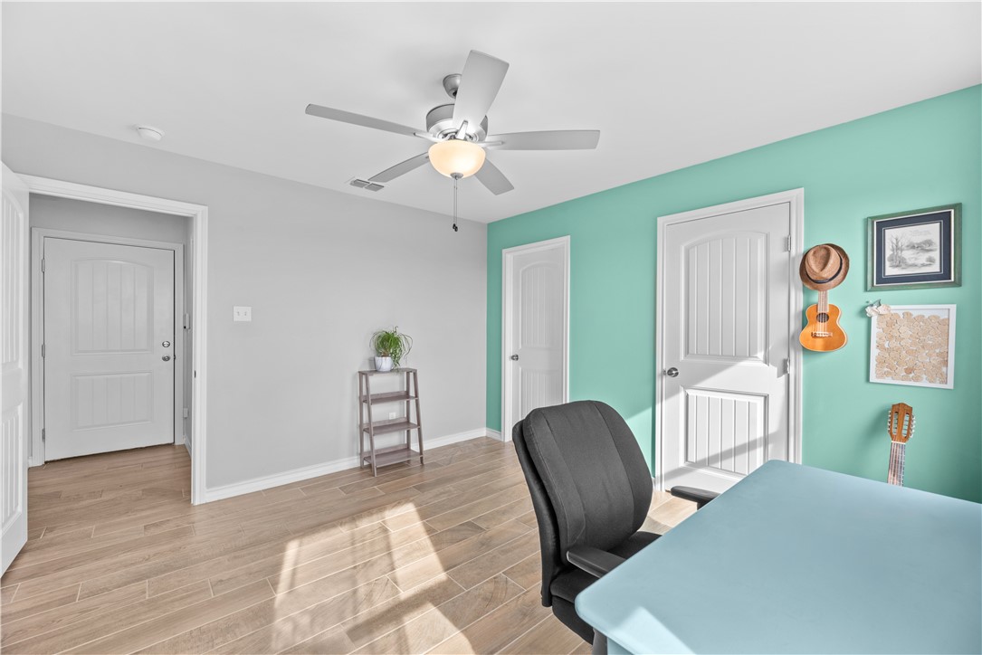 103 Atkinson Drive Orange Grove, TX 78372 - Photo 14 of 30 a view of a livingroom with furniture and wooden floor