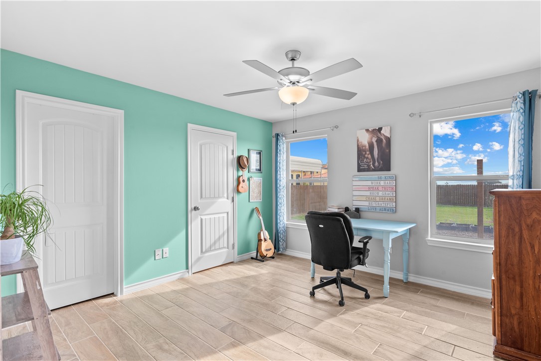 103 Atkinson Drive Orange Grove, TX 78372 - Photo 15 of 30 a view of a workspace with furniture and a window