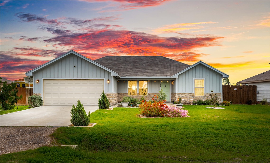 103 Atkinson Drive Orange Grove, TX 78372 - Photo 2 of 30 a front view of house with yard and outdoor seating
