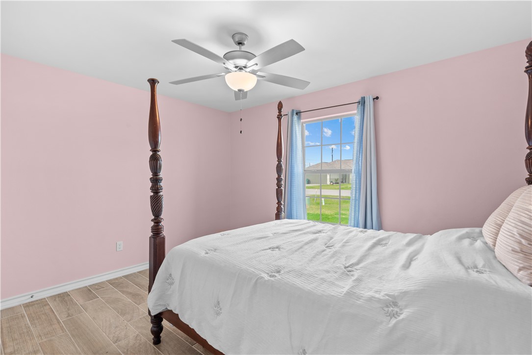 103 Atkinson Drive Orange Grove, TX 78372 - Photo 24 of 30 a bedroom with a bed and a window