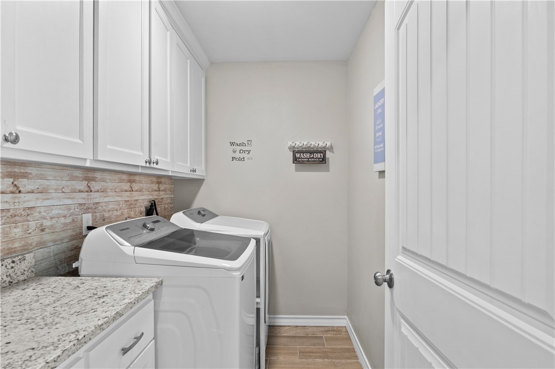103 Atkinson Drive Orange Grove, TX 78372 - Photo 25 of 30 a utility room with dryer and washer