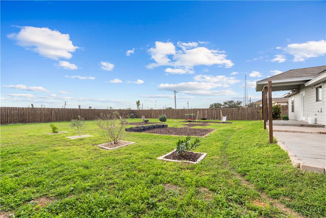 103 Atkinson Drive Orange Grove, TX 78372 - Photo 28 of 30 a view of a lake with a big yard