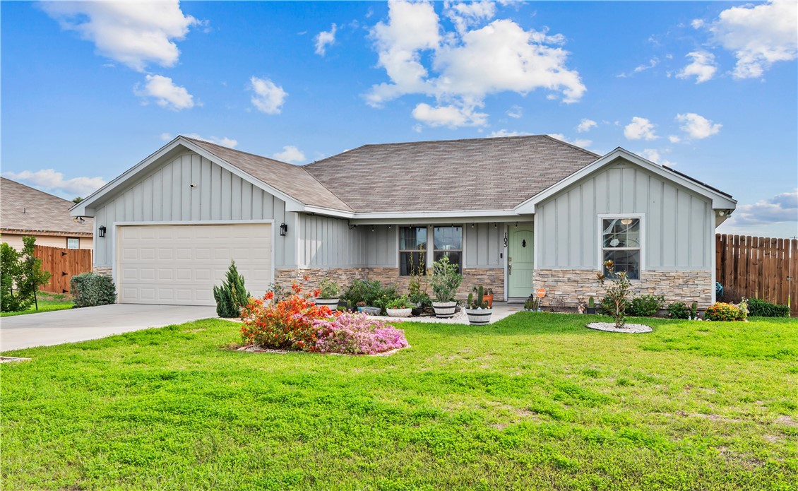 103 Atkinson Drive Orange Grove, TX 78372 - Photo 3 of 30 a front view of house with yard and outdoor seating