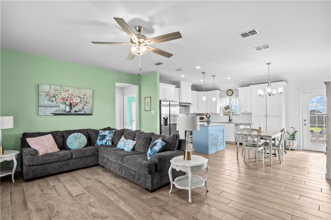 103 Atkinson Drive Orange Grove, TX 78372 - Photo 6 of 30 a living room with furniture and kitchen view
