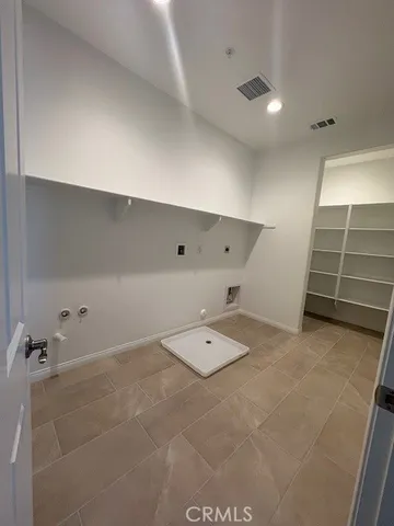 a view of a room with rack on the wall