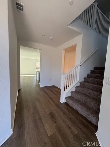 a view of entryway with wooden floor