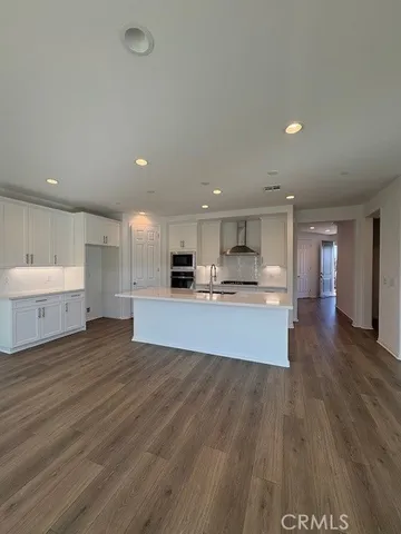 a view of kitchen with wooden floor
