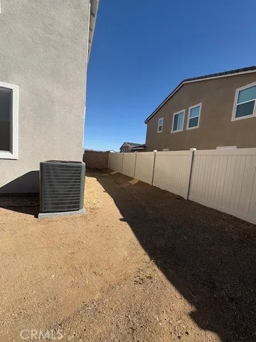 a view of a back yard of the house