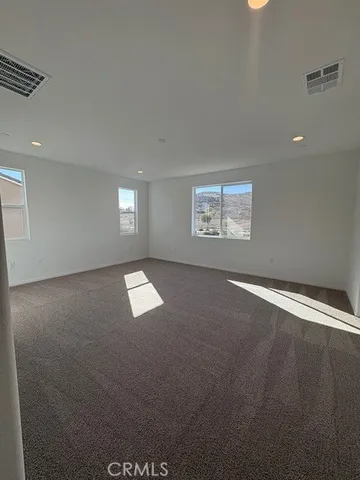 a room with a large window and a sink