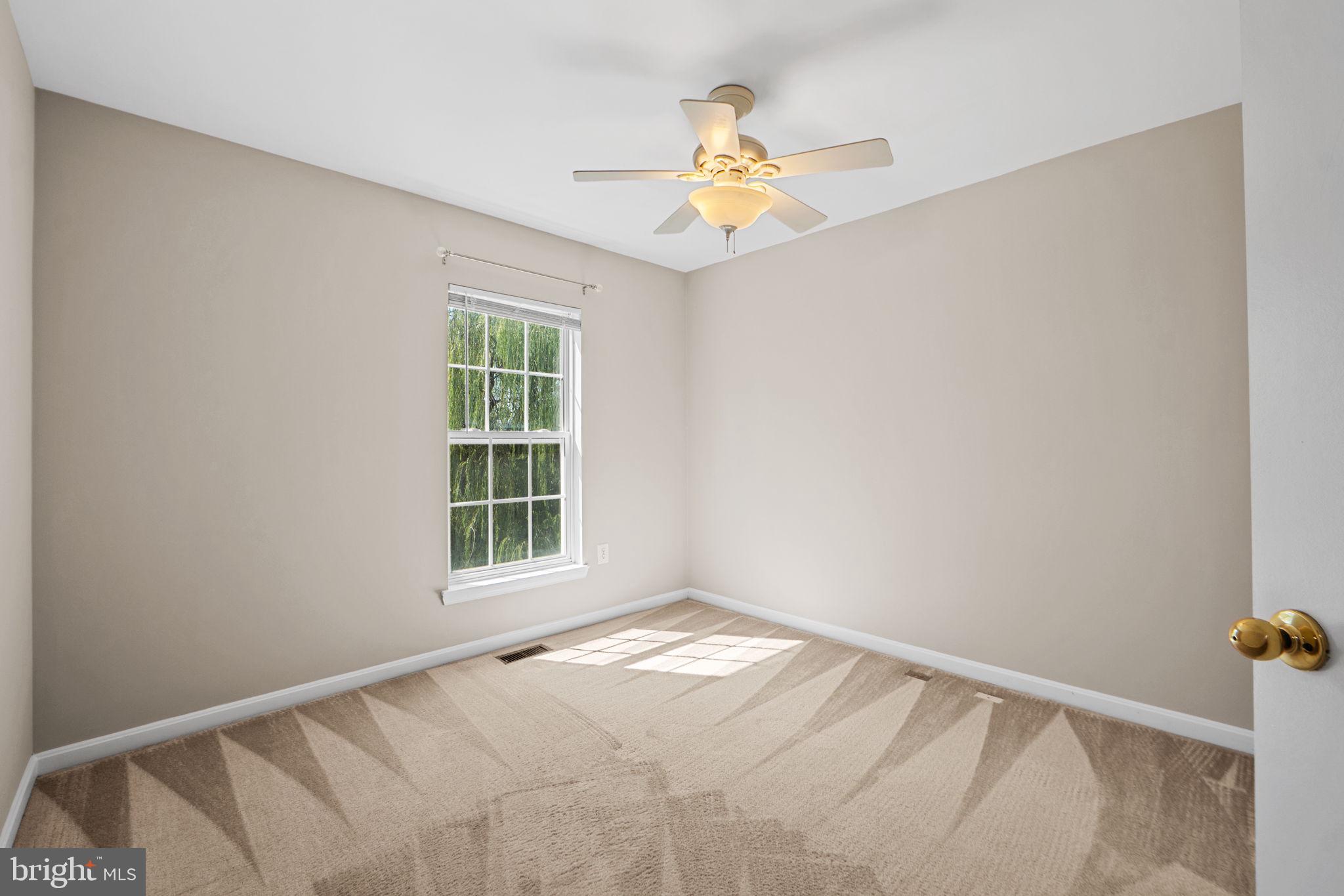 23404 Rainbow Arch Drive, Unit 115 Clarksburg, MD 20871 - Photo 11 of 34 a view of an empty room with a window