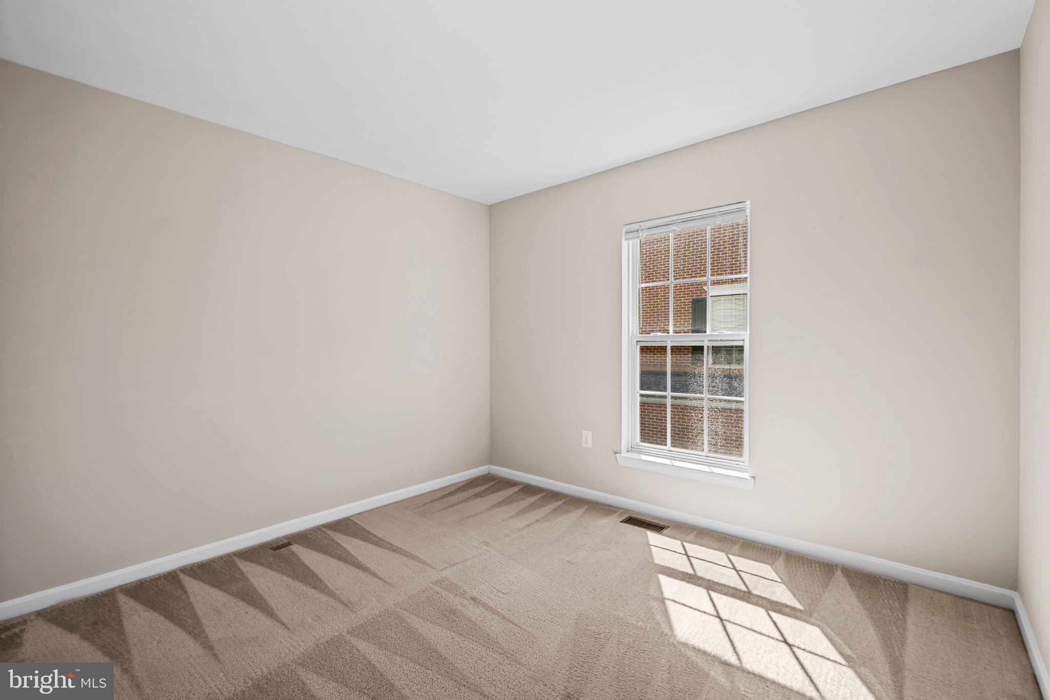 23404 Rainbow Arch Drive, Unit 115 Clarksburg, MD 20871 - Photo 14 of 34 a view of an empty room with a window