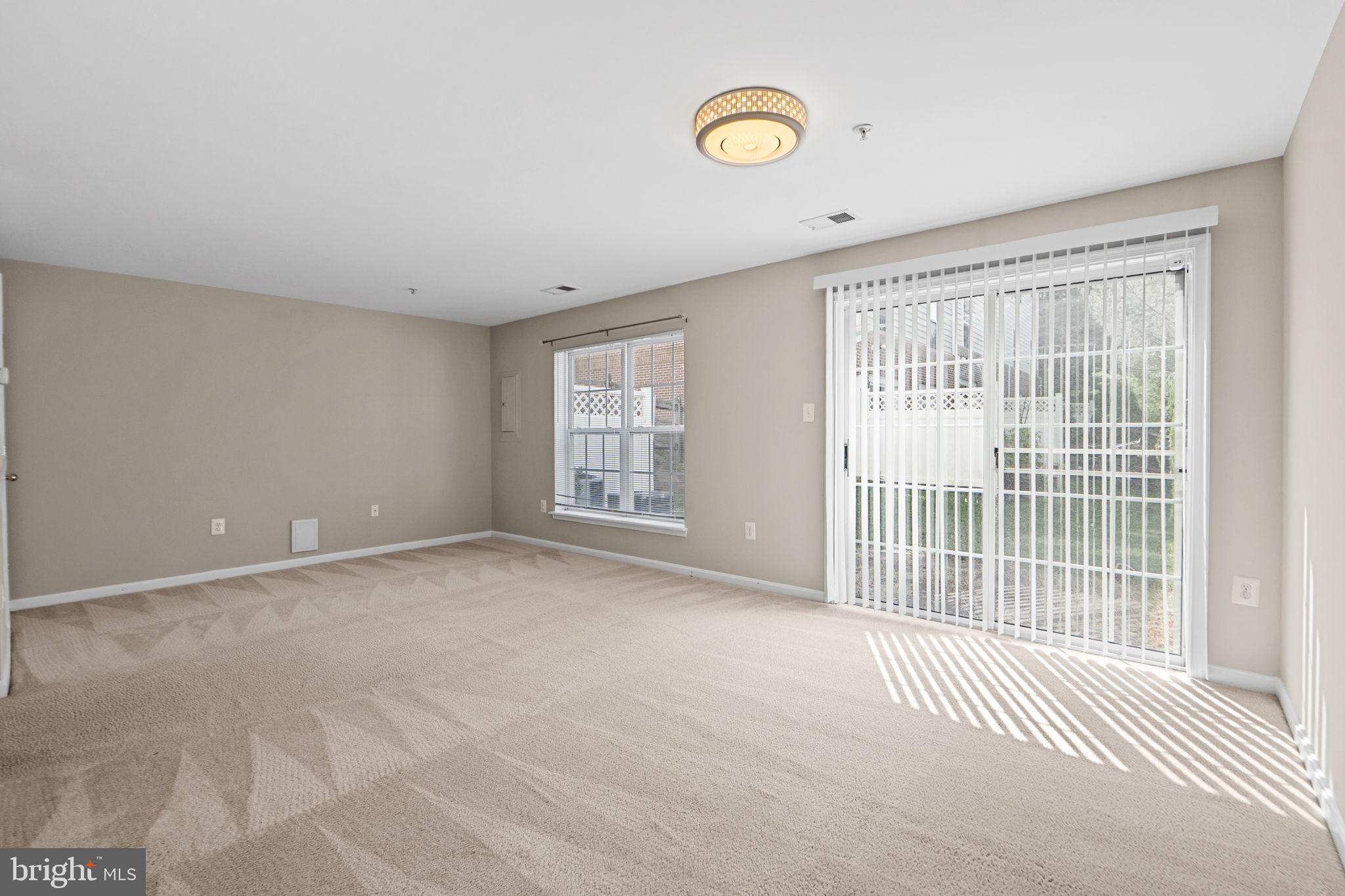 23404 Rainbow Arch Drive, Unit 115 Clarksburg, MD 20871 - Photo 23 of 34 a view of an empty room with a window