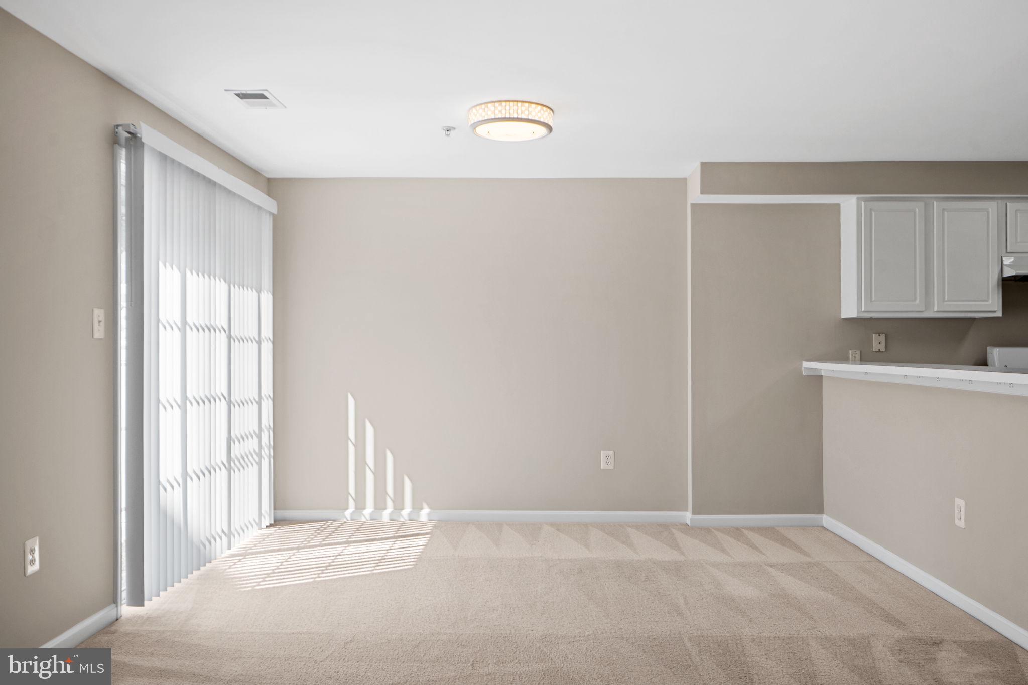 23404 Rainbow Arch Drive, Unit 115 Clarksburg, MD 20871 - Photo 25 of 34 a view of an empty room with a window