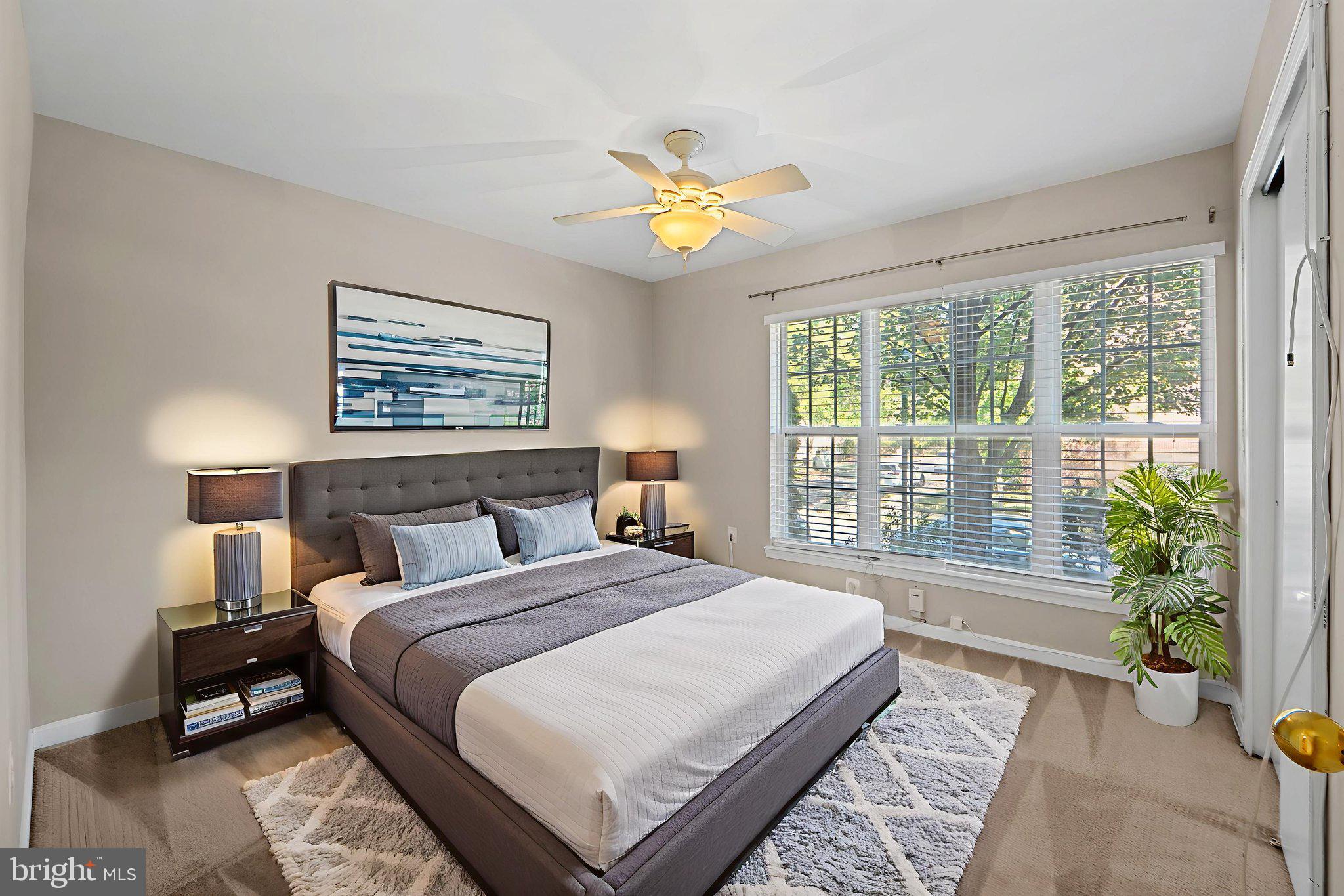 23404 Rainbow Arch Drive, Unit 115 Clarksburg, MD 20871 - Photo 7 of 34 a bedroom with a bed and a window