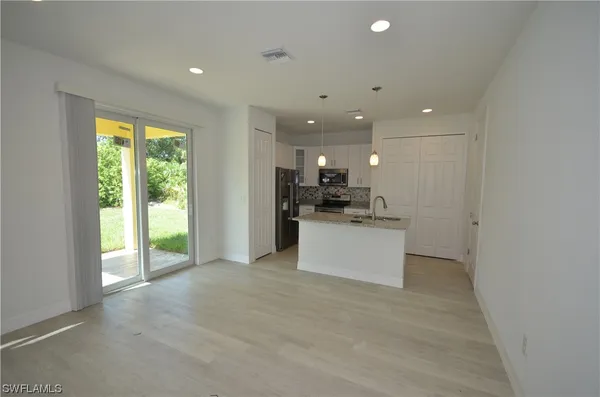 a view of kitchen and front door
