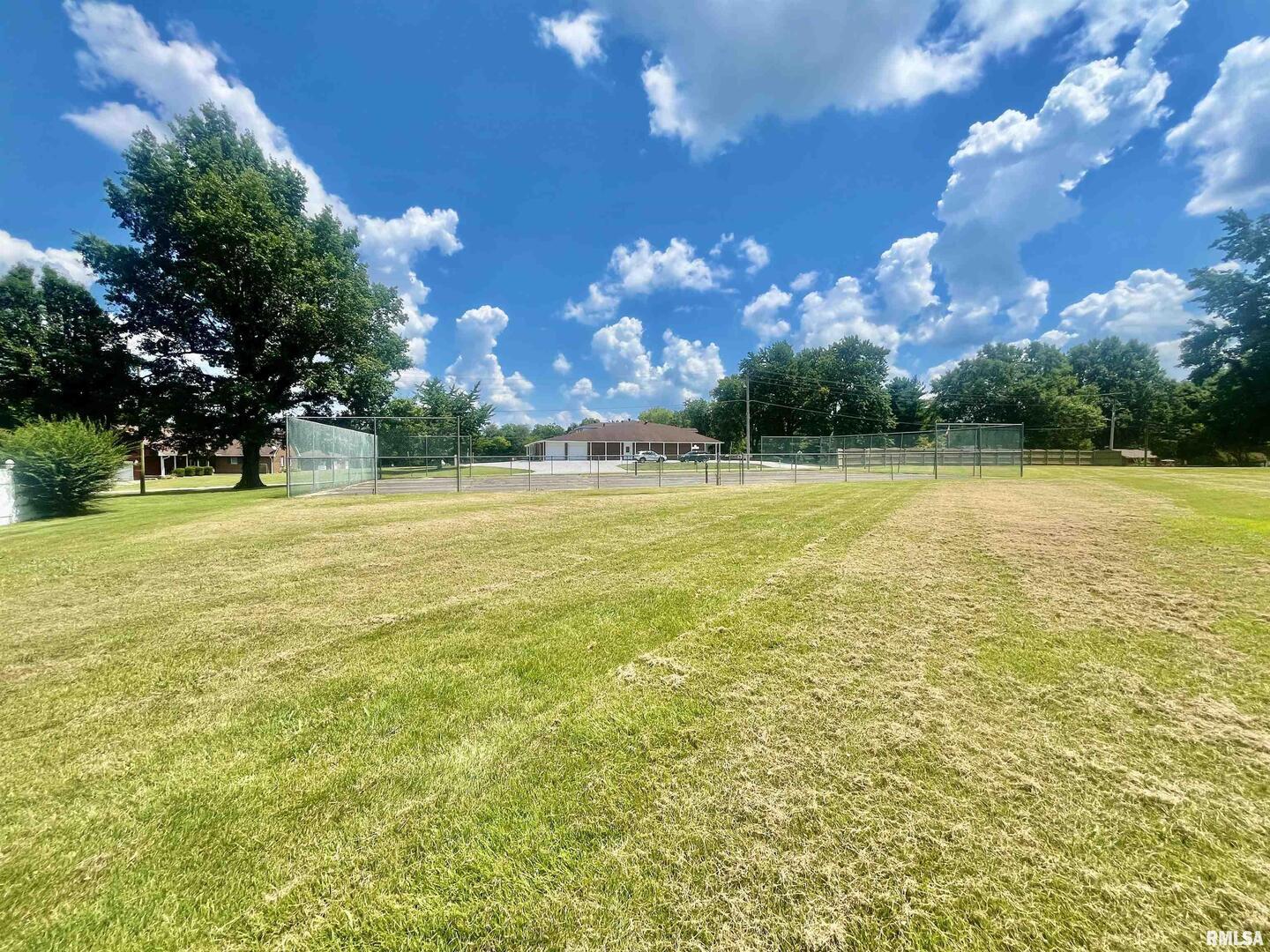9 Brian Drive Metropolis, IL 62960 - Photo 14 of 71 a view of a swimming pool with an outdoor space and seating area