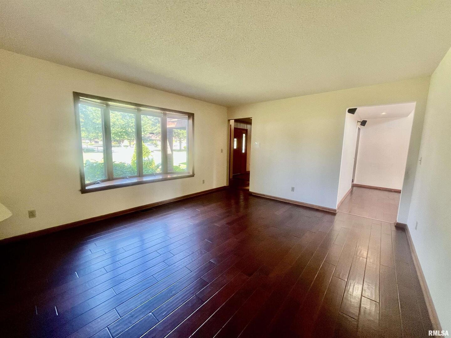 9 Brian Drive Metropolis, IL 62960 - Photo 21 of 71 an empty room with wooden floor and windows
