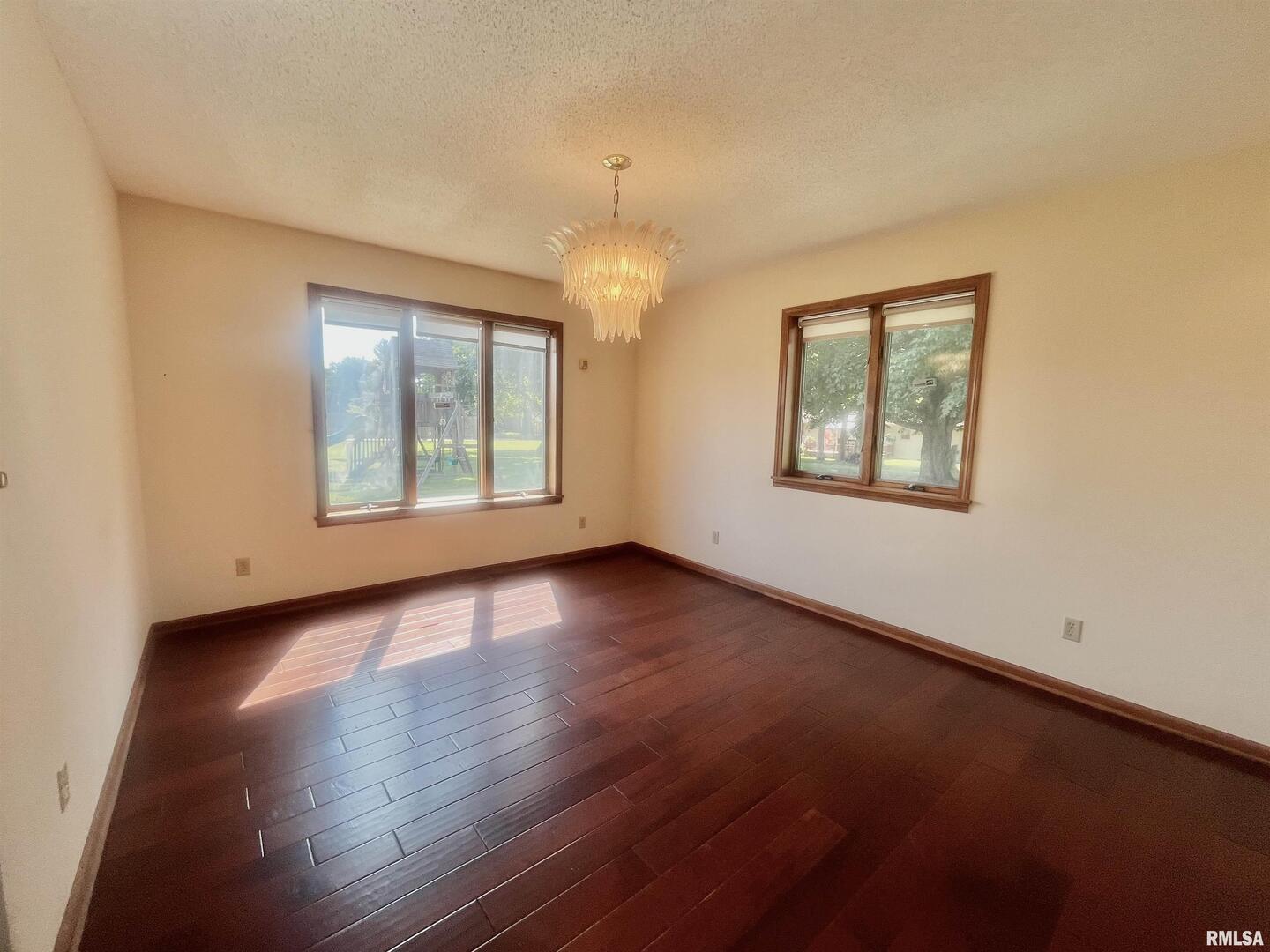 9 Brian Drive Metropolis, IL 62960 - Photo 33 of 71 an empty room with wooden floor and windows