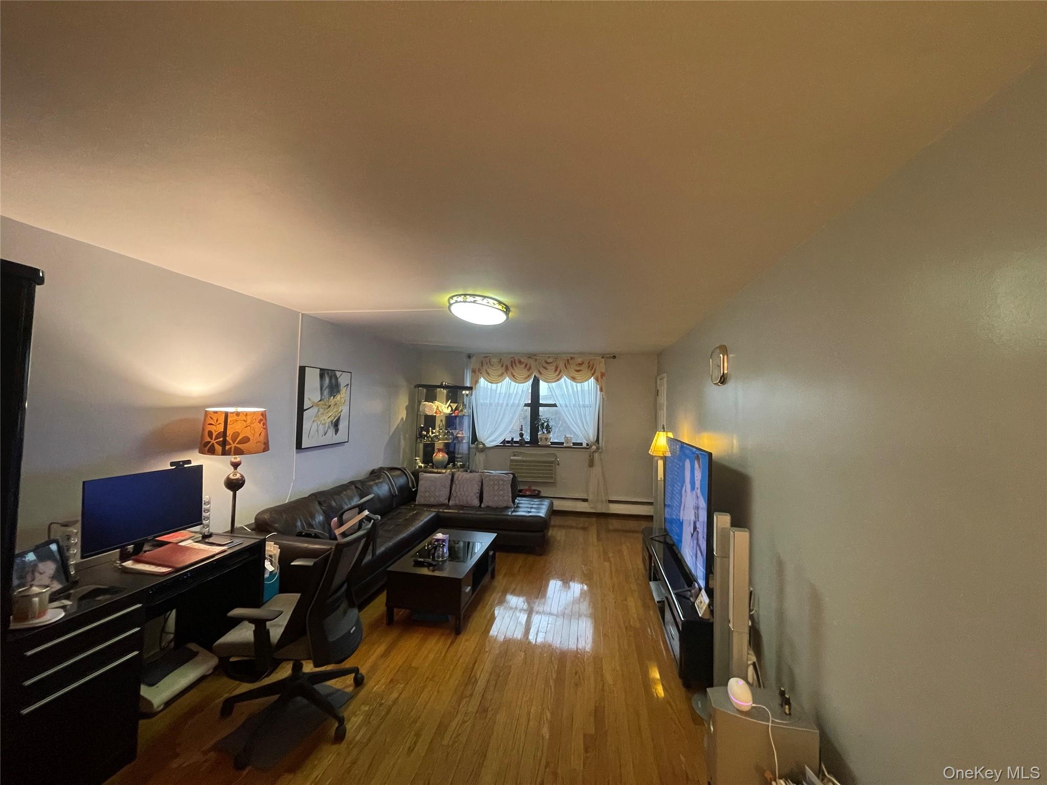 99-35 59th Avenue, Unit 5E Queens, NY 11368 - Photo 4 of 11 Home office with hardwood / wood-style floors