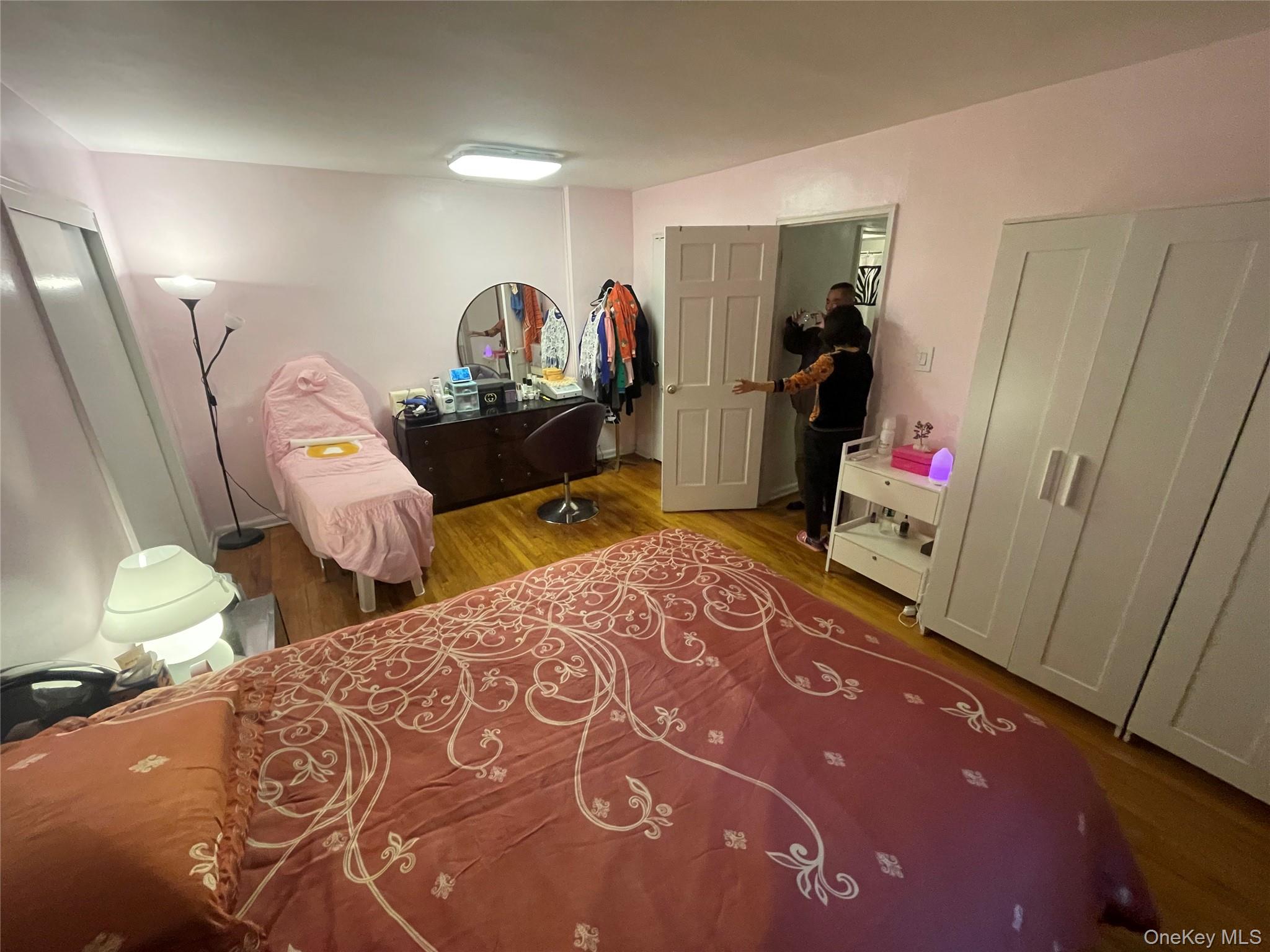 99-35 59th Avenue, Unit 5E Queens, NY 11368 - Photo 9 of 11 Bedroom with wood finished floors