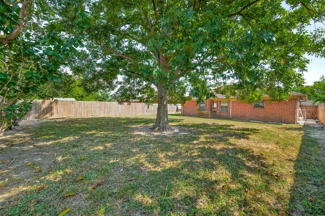 a backyard of a house with lots of green space