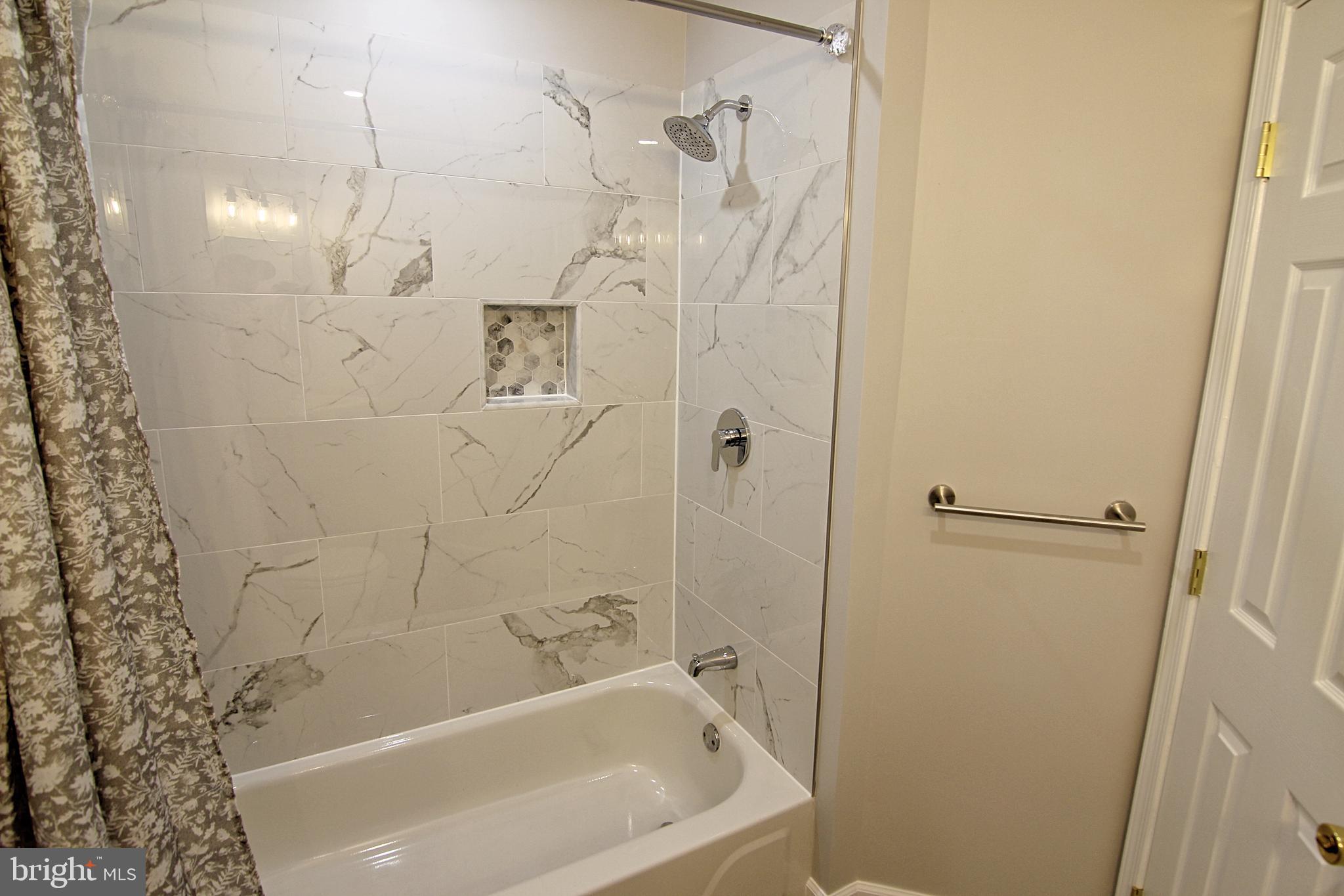 7923-31 Ridge Avenue, Unit 38 Philadelphia, PA 19128 - Photo 16 of 23 a bathroom with a bathtub