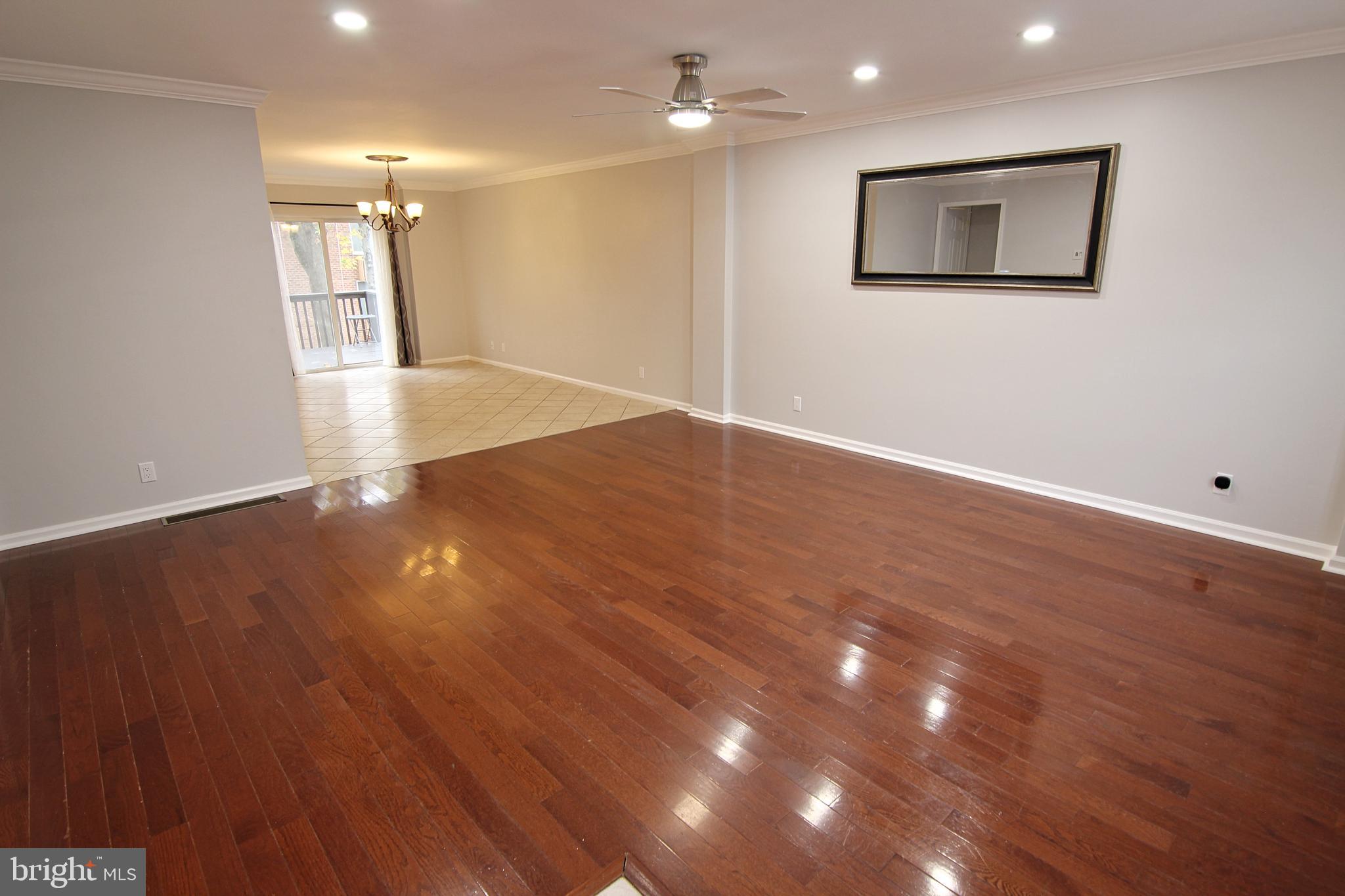 7923-31 Ridge Avenue, Unit 38 Philadelphia, PA 19128 - Photo 2 of 23 a view of an empty room with wooden floor