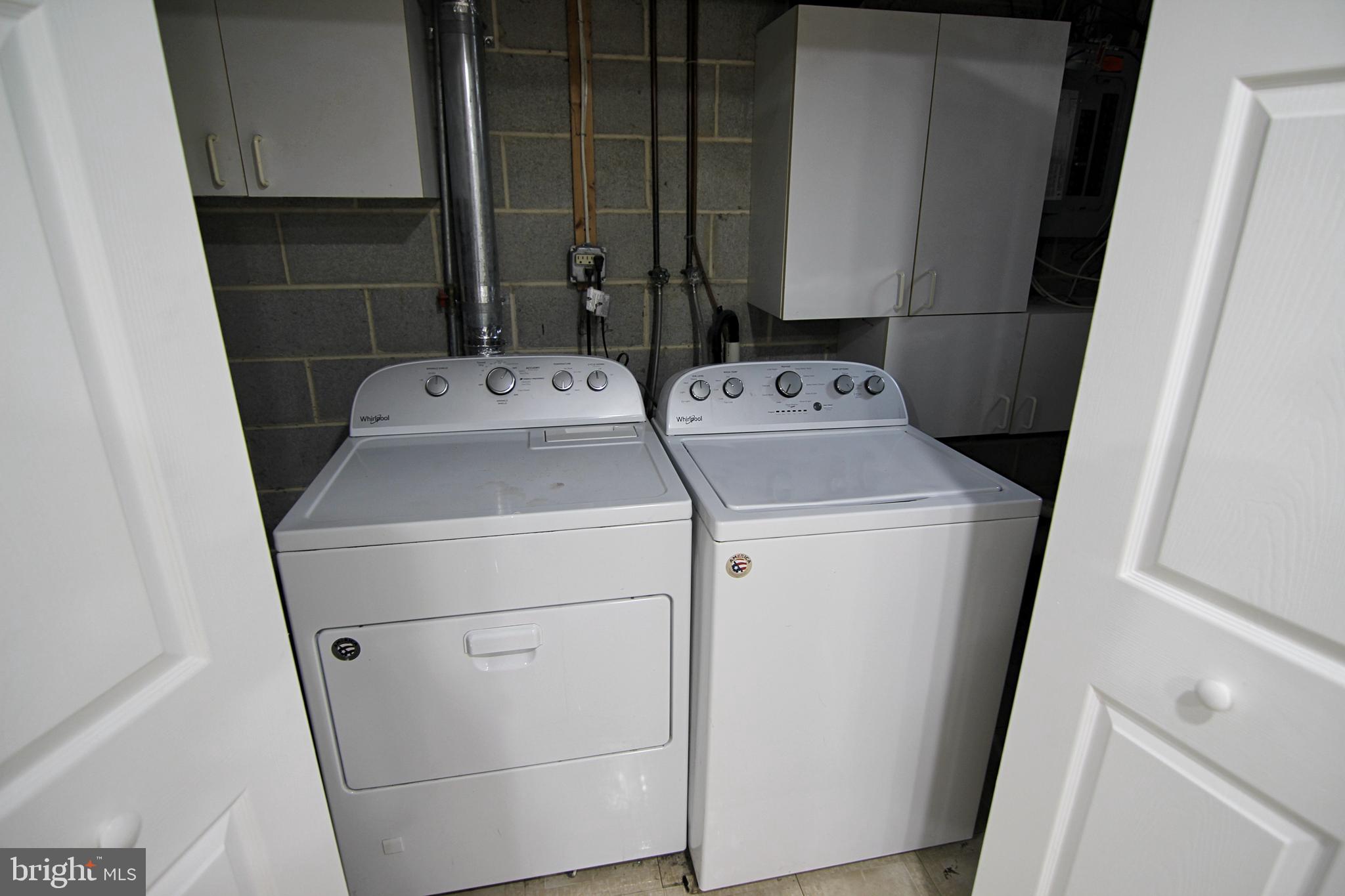7923-31 Ridge Avenue, Unit 38 Philadelphia, PA 19128 - Photo 21 of 23 a utility room with dryer and washer