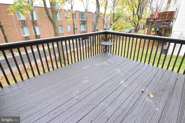 a view of balcony with wooden floor