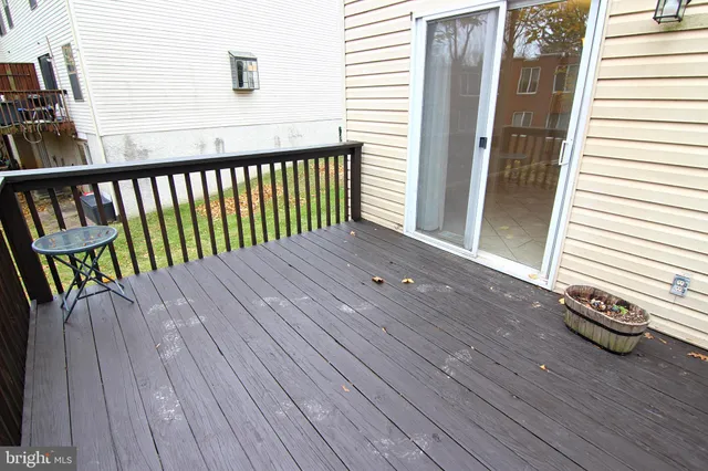 a bathroom with a sink mirror and toilet