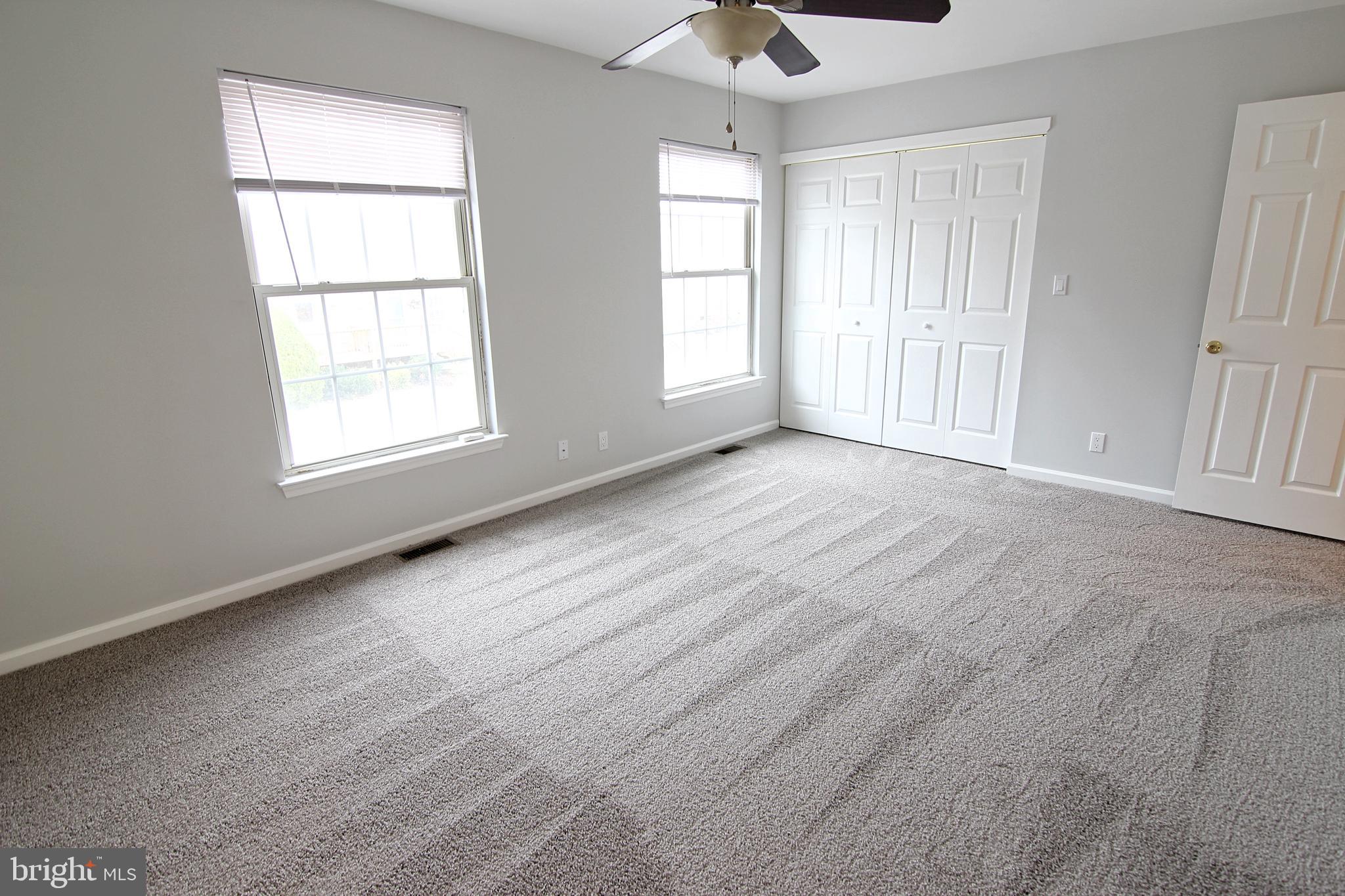 7923-31 Ridge Avenue, Unit 38 Philadelphia, PA 19128 - Photo 10 of 23 an empty room with windows and closet