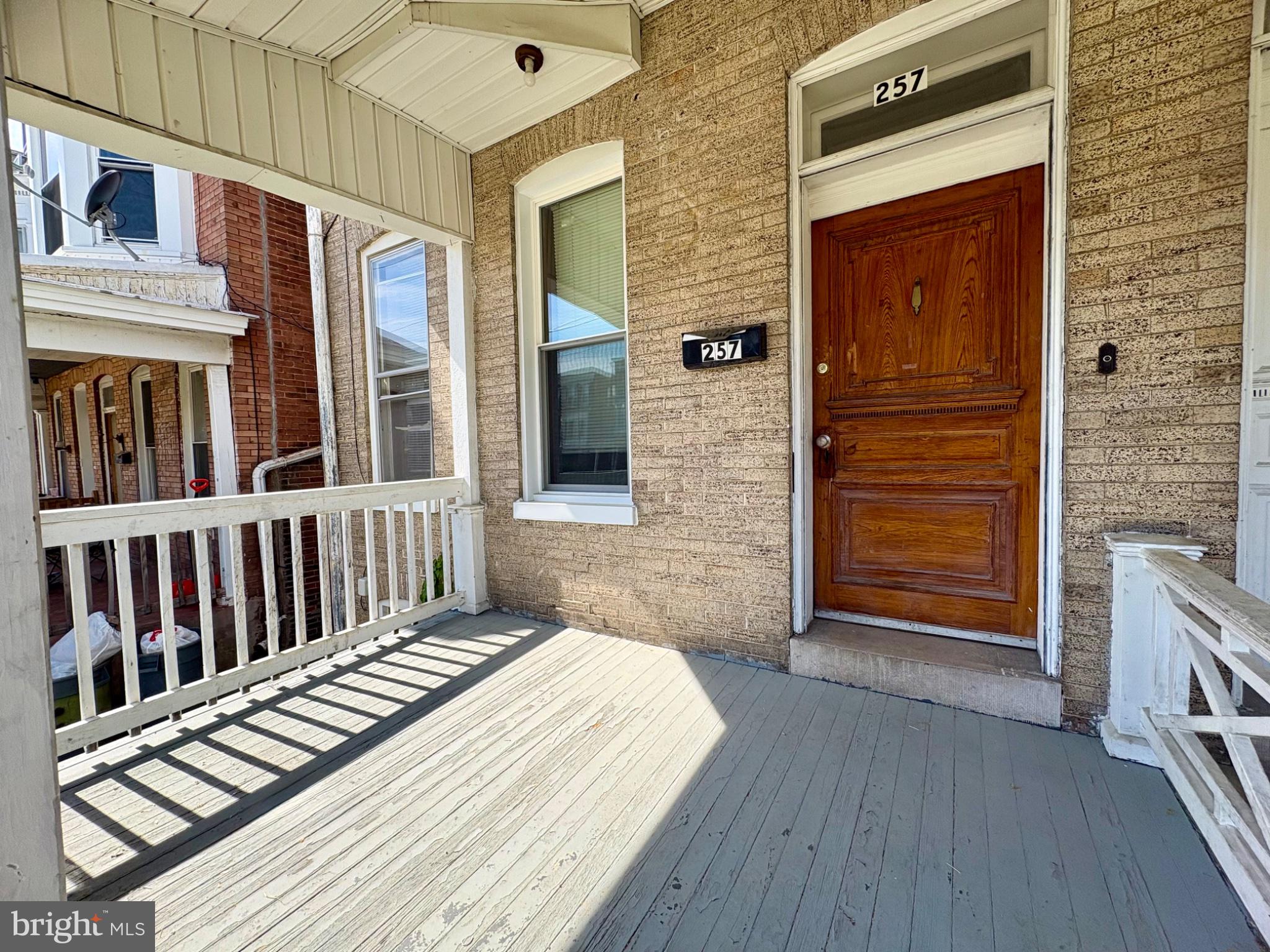 257 West Jackson Street York, PA 17401 - Photo 2 of 27 a view of a wooden door and a outdoor space
