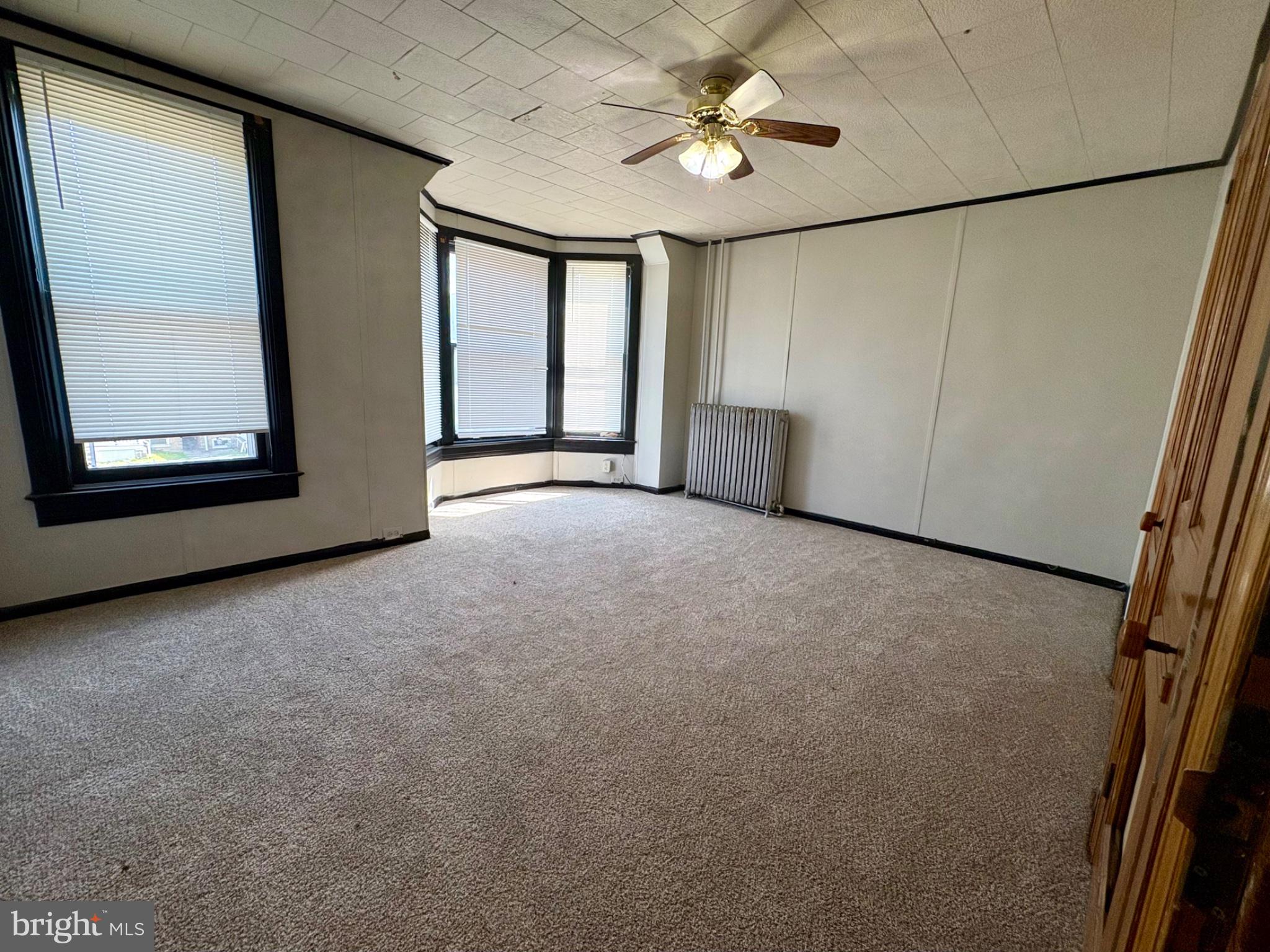 257 West Jackson Street York, PA 17401 - Photo 21 of 27 an empty room with windows and fan
