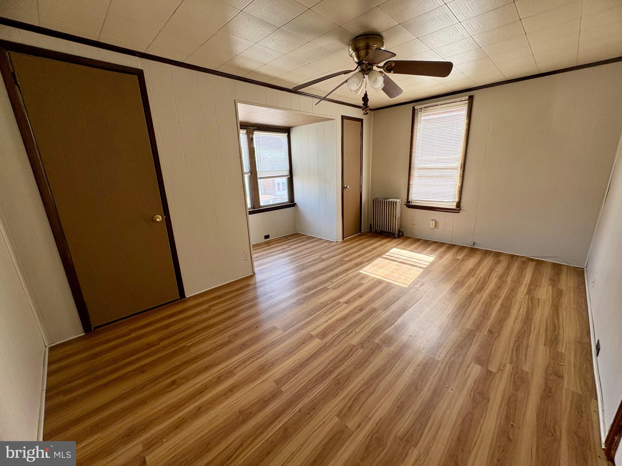 257 West Jackson Street York, PA 17401 - Photo 26 of 27 a view of an empty room with wooden floor and a window