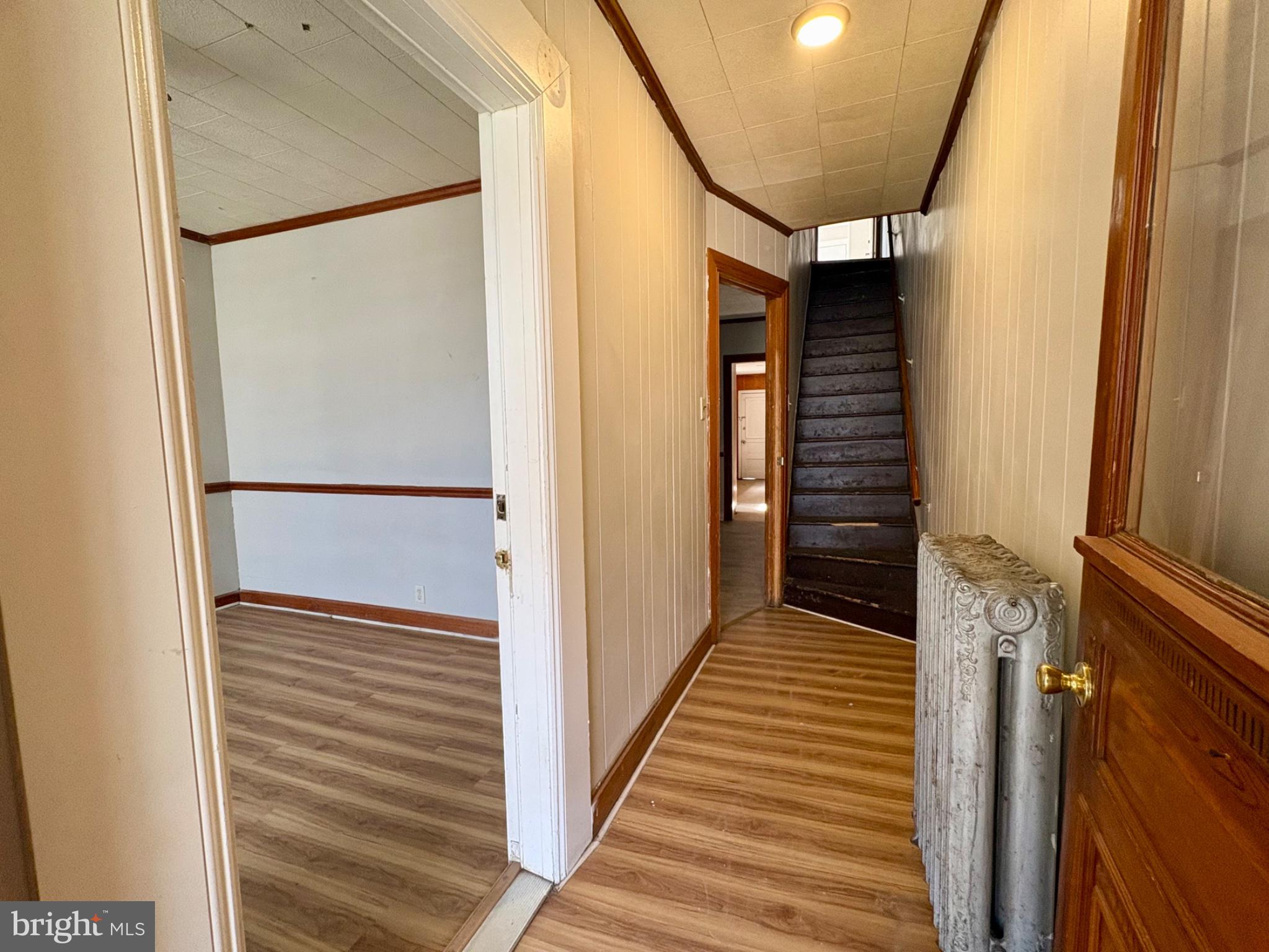 257 West Jackson Street York, PA 17401 - Photo 3 of 27 a view of a hallway with wooden floor and staircase
