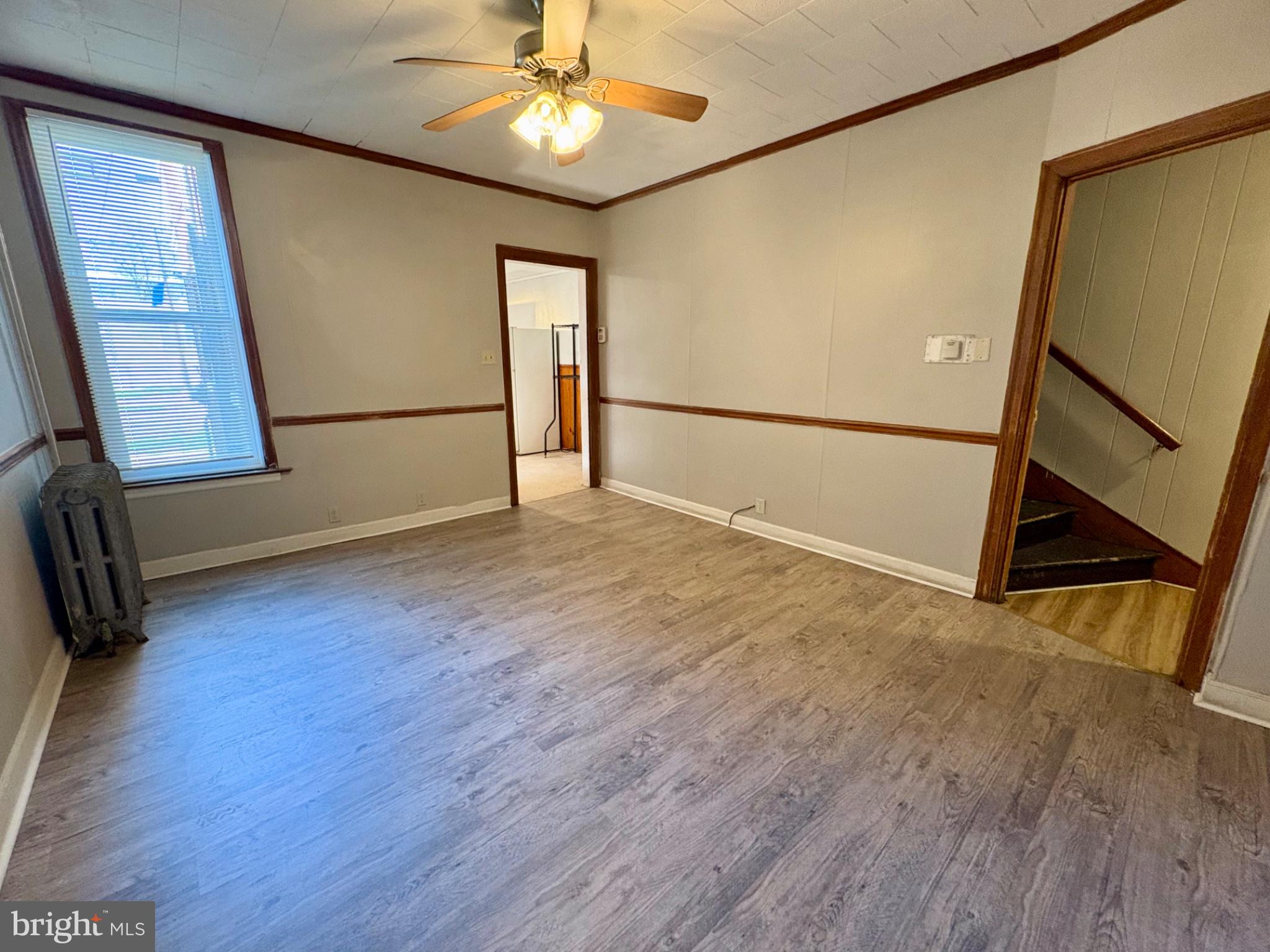 257 West Jackson Street York, PA 17401 - Photo 6 of 27 a view of an empty room with wooden floor and a window