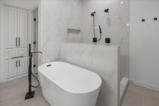 an empty room with a ceiling fan and window