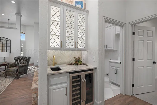 a kitchen with a sink and an oven